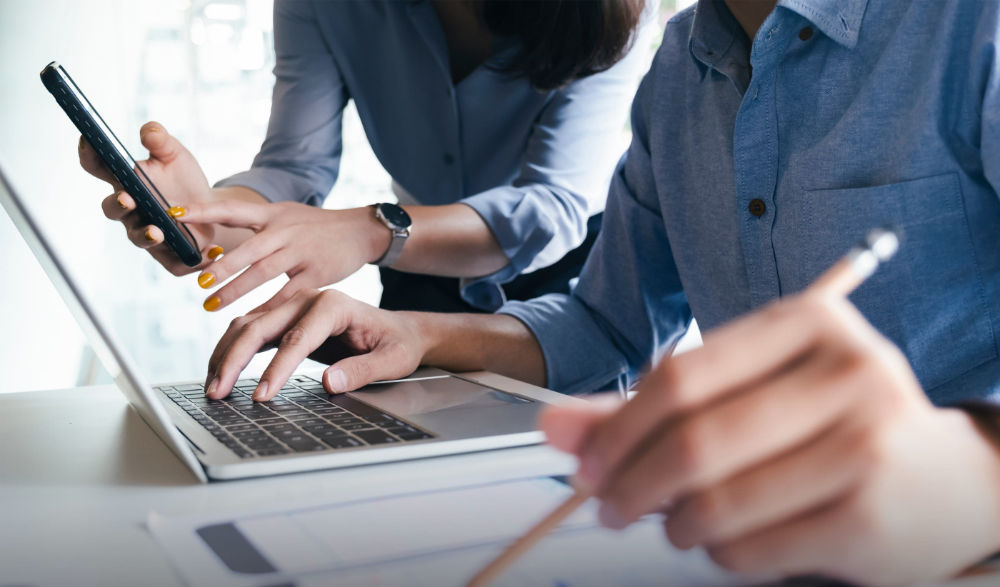 Experts using technology for quality assurance in production services, ensuring reliable functionality and effective products.