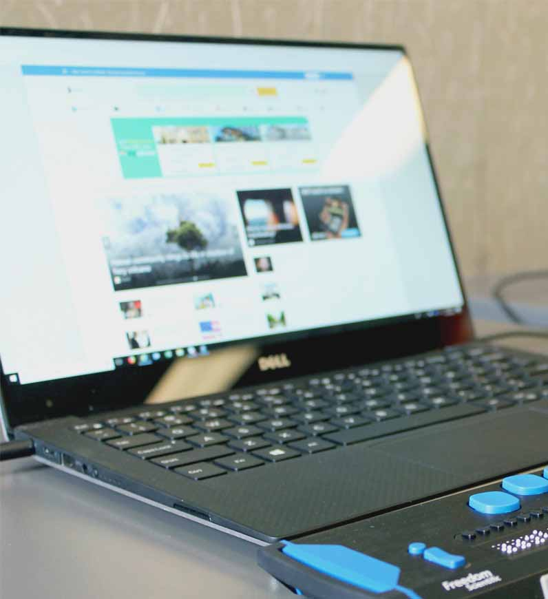 A laptop computer positioned on a desk, evaluated by an accessibility audit service to ensure compliance with industry standards 