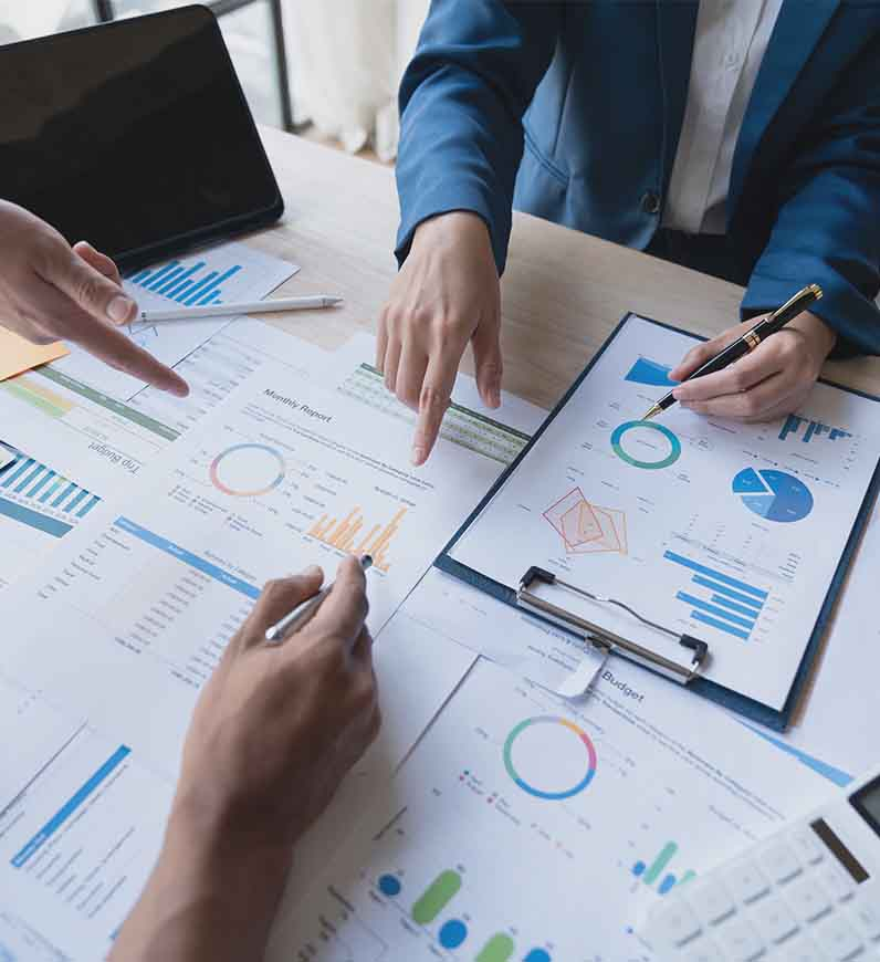 Research professionals collaborating on a strategic research plan, discussing ideas and analyzing data