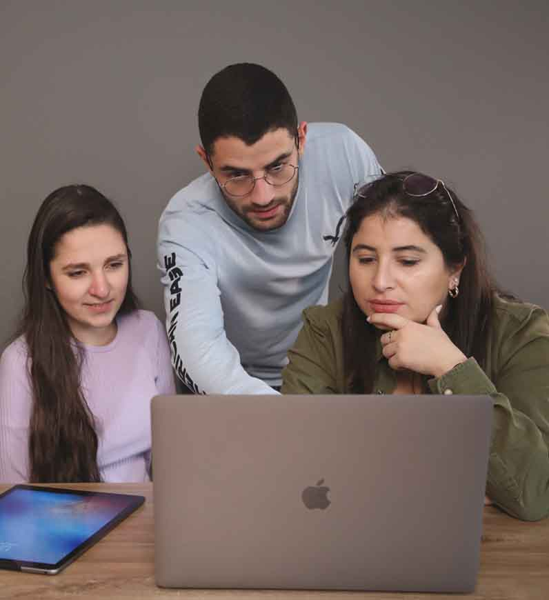 UX researcher holding a table, reporting all the research activities performed, the findings, and all the possible personas 