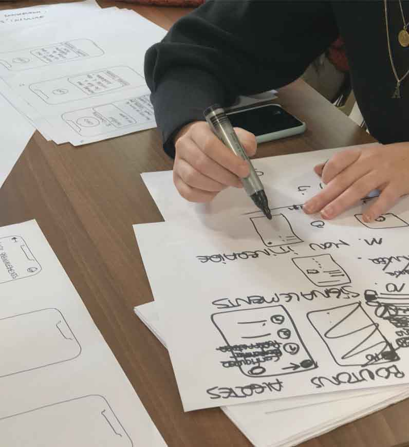 UX researcher working on user stories to add value, get higher ROI, and increase engagement for a client's project