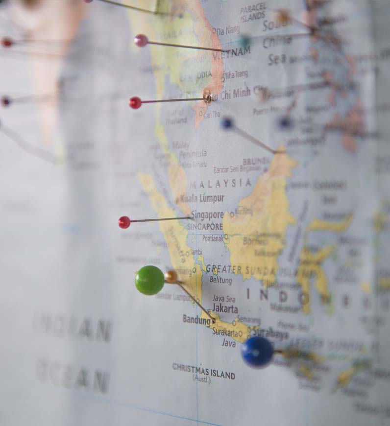 Map with pins, representing culturally sensitive approach for successful products in global markets.