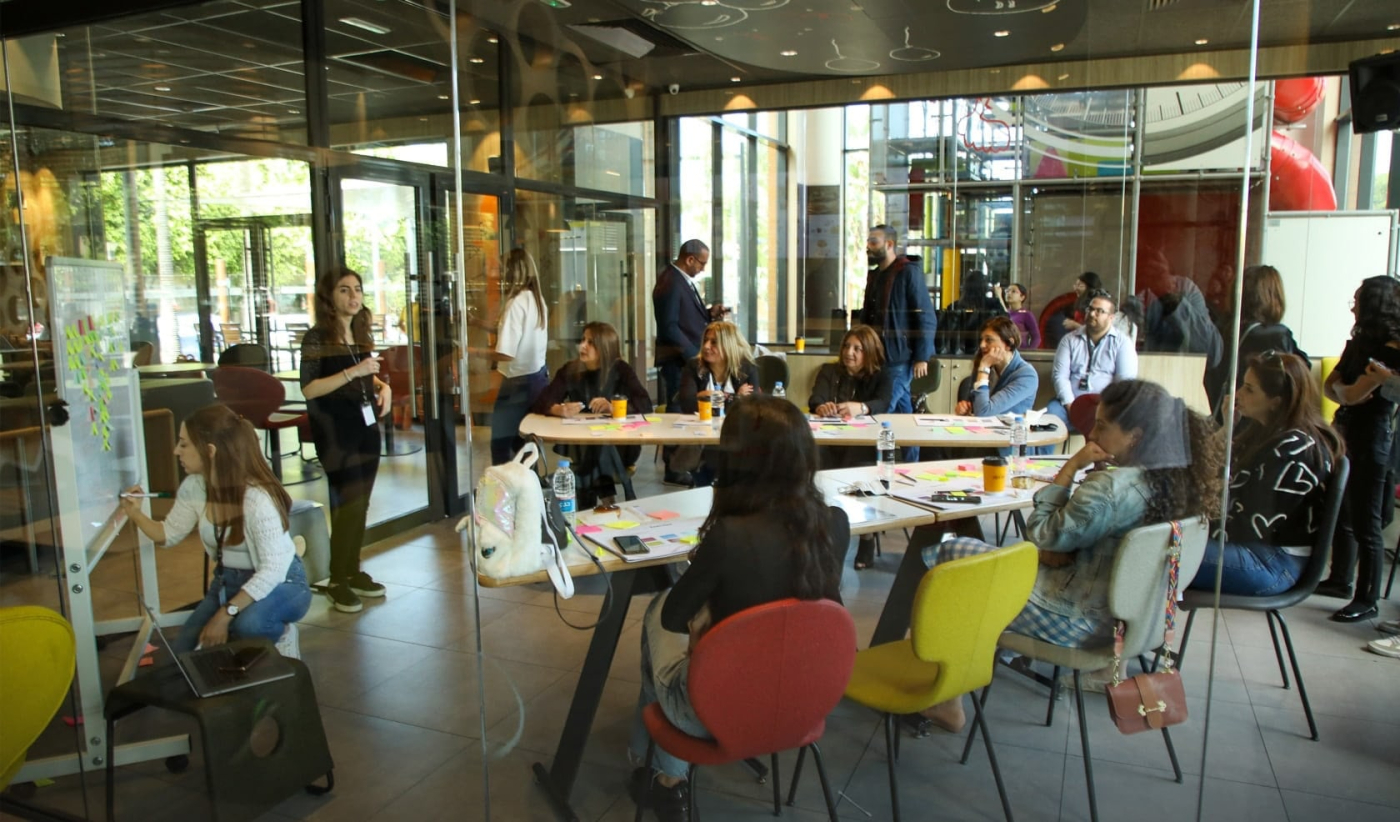 Experts conducting a workshop on innovative UX/UI design strategies